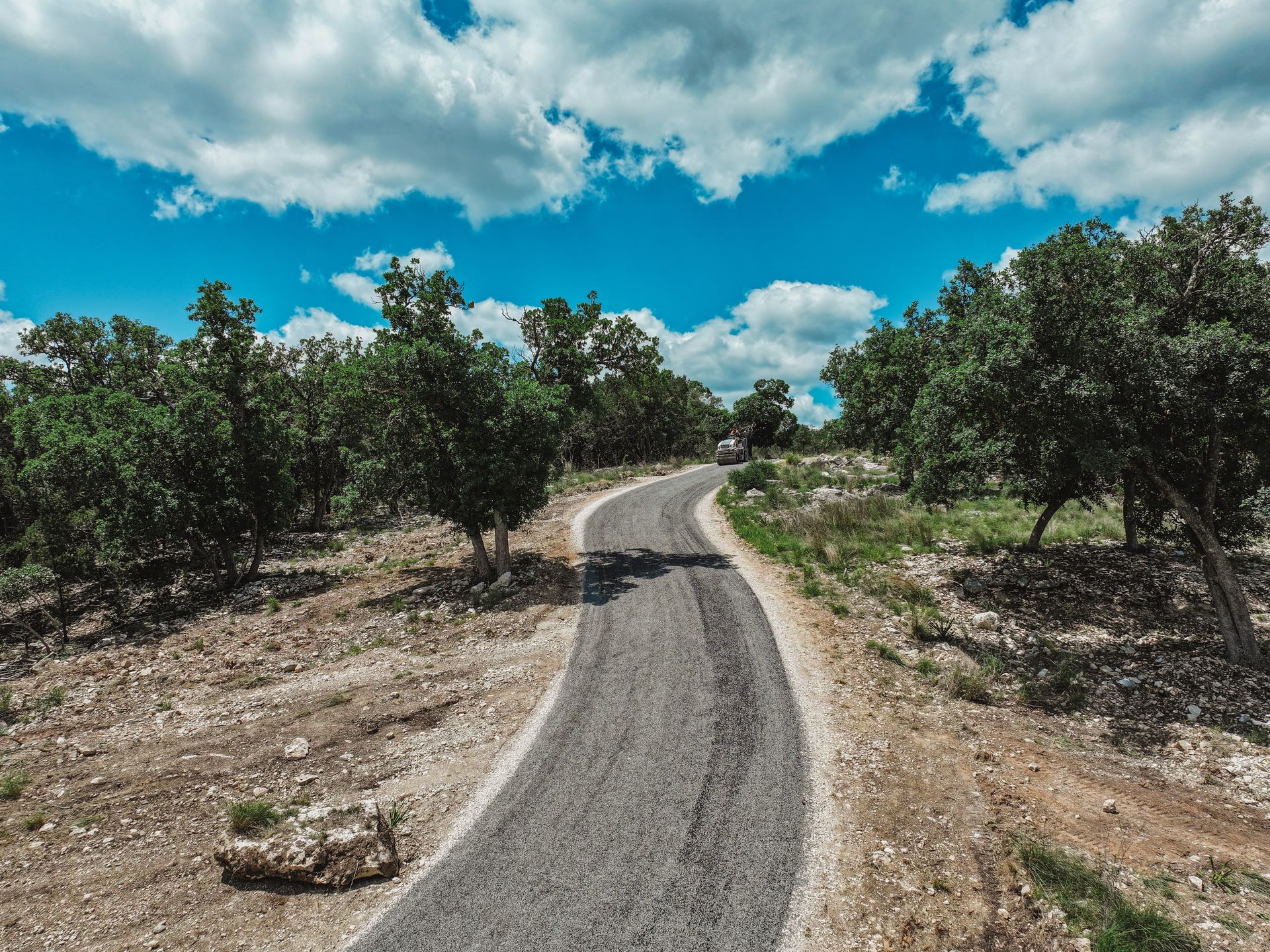 Aerial view of a rural road during surface work