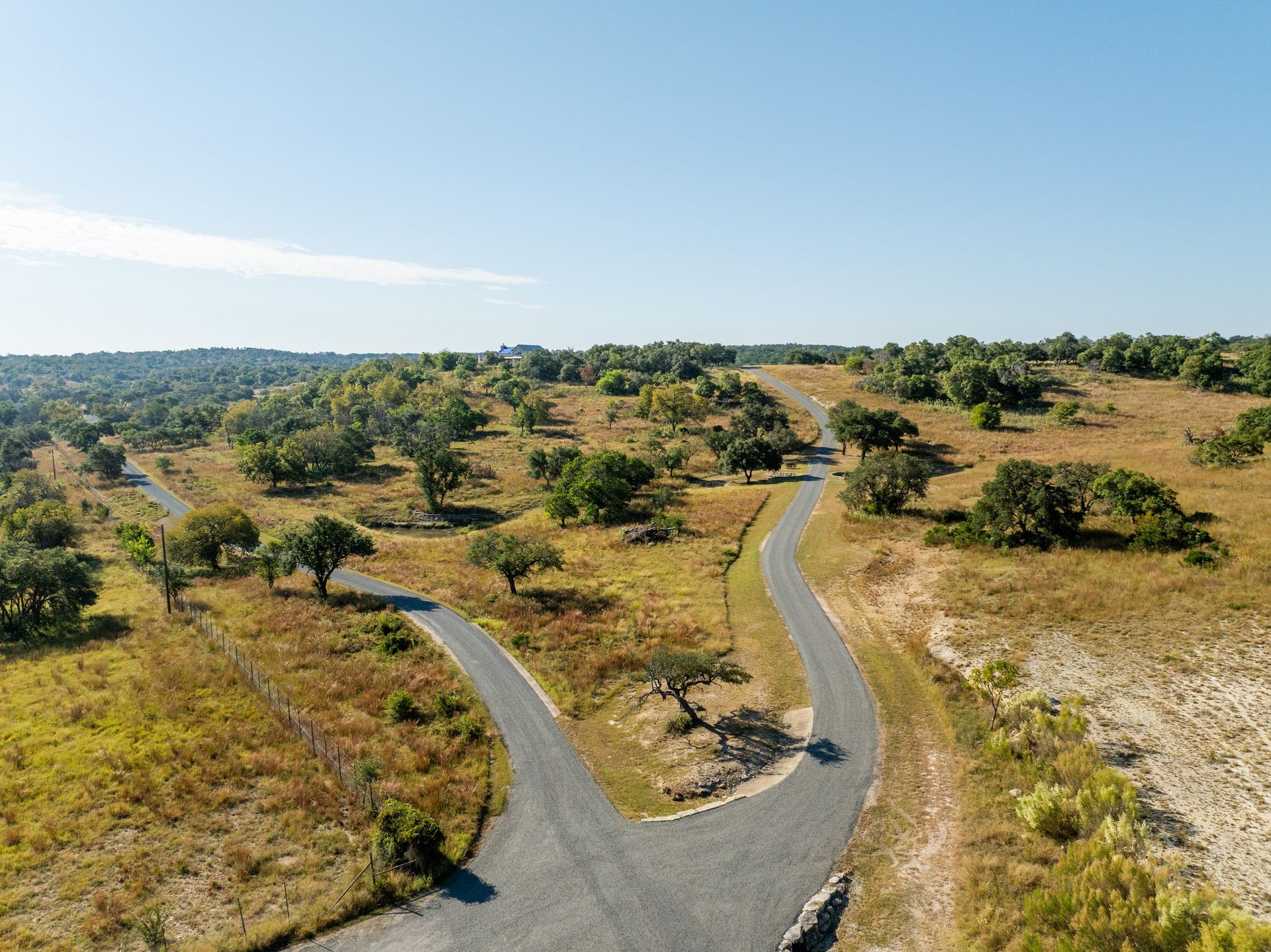 Aerial view of winding roads across an open rural property